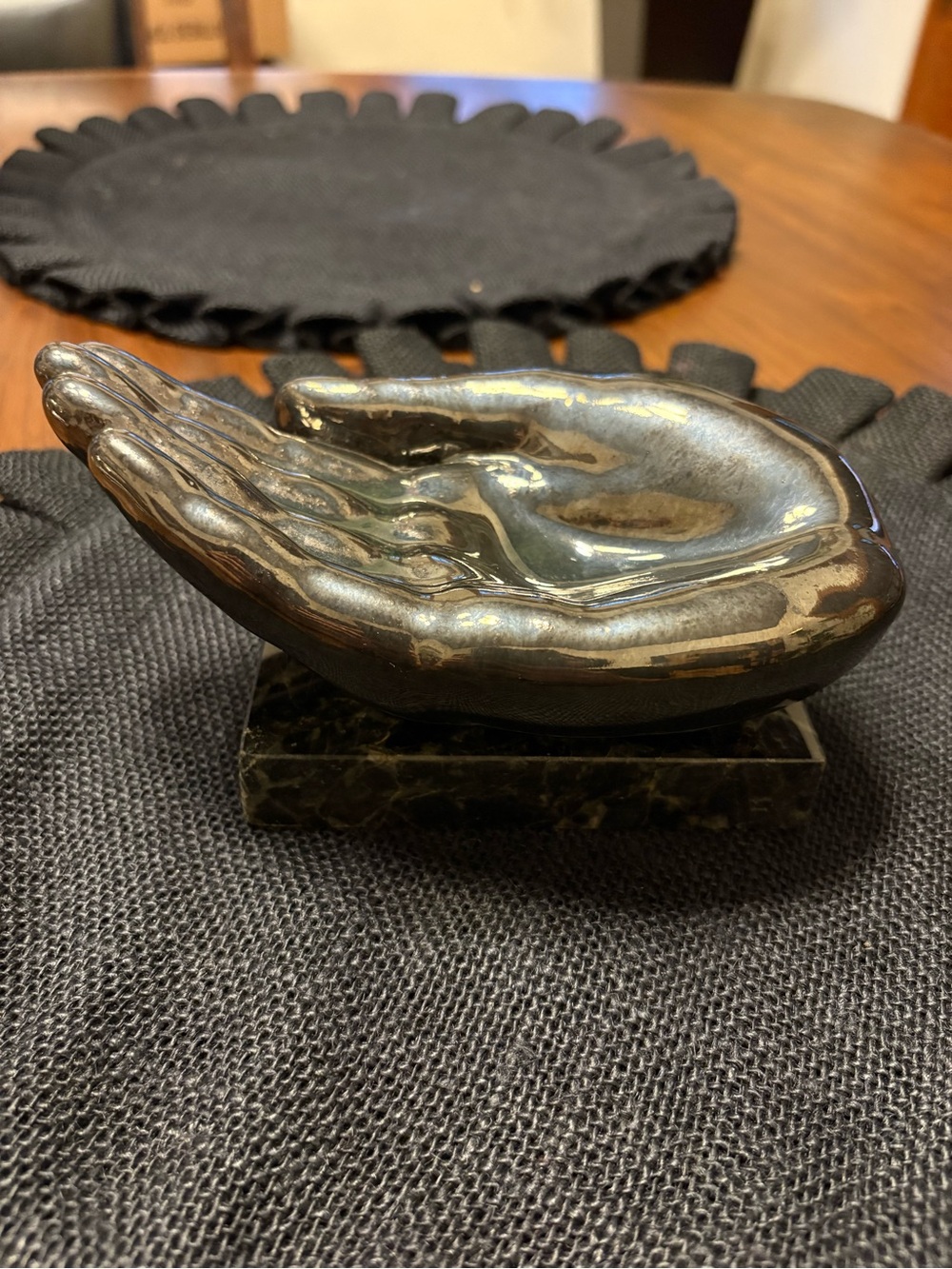 Silver vintage ceramic hand-shaped catchall dish on black marble VGUC